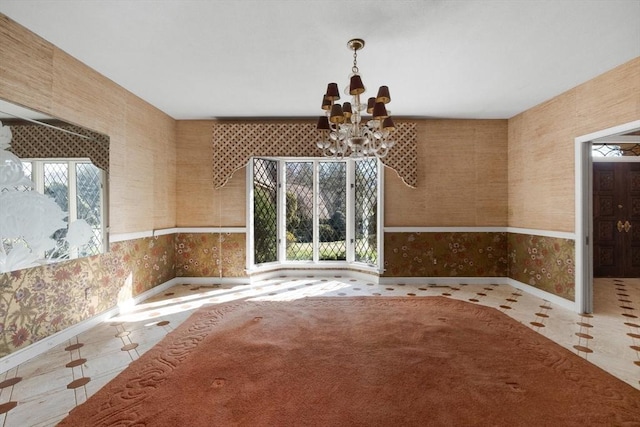 21 Wildewood Dr, Lynnfield, MA 01940 - unfurnished dining area featuring a chandelier, wallpapered walls, and baseboards