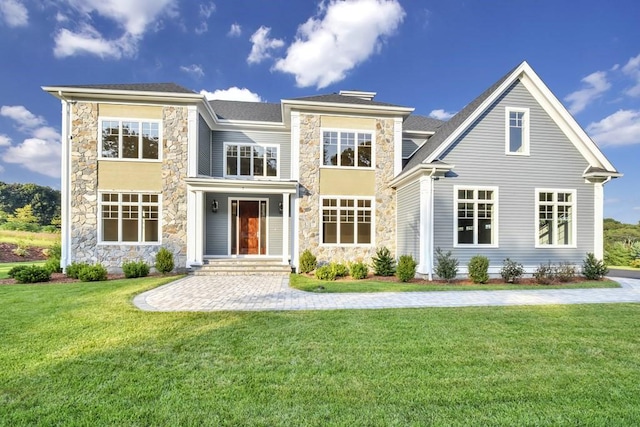 7 Stage Coach Rd, Lexington, MA 02421 - rear view of property featuring stone siding and a yard