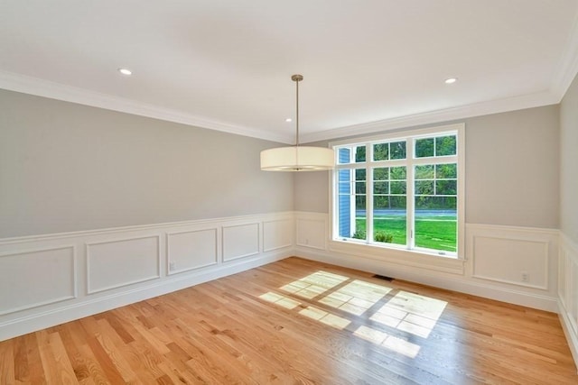 7 Stage Coach Rd, Lexington, MA 02421 - unfurnished dining area featuring a wainscoted wall, light wood-style flooring, visible vents, ornamental molding, and recessed lighting