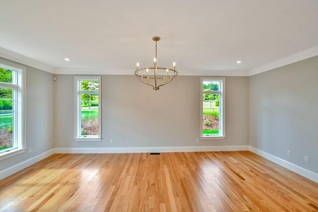 7 Stage Coach Rd, Lexington, MA 02421 - empty room with baseboards, crown molding, and an inviting chandelier