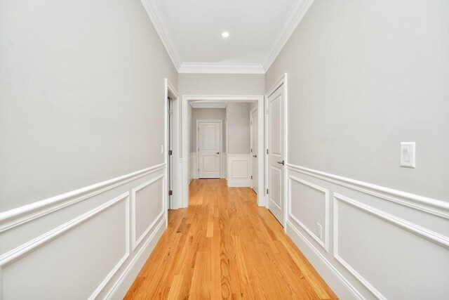 7 Stage Coach Rd, Lexington, MA 02421 - hall with crown molding, light wood finished floors, and wainscoting