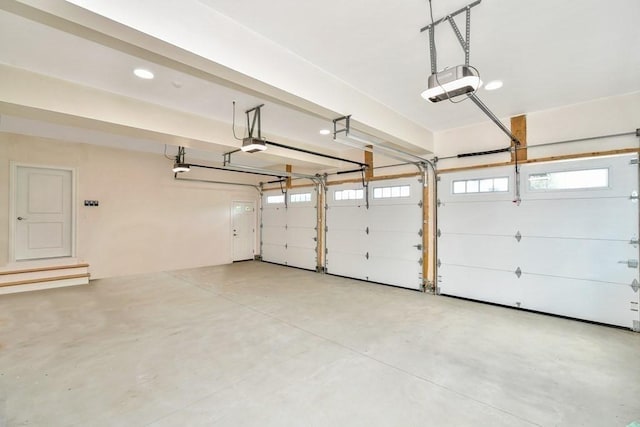 7 Stage Coach Rd, Lexington, MA 02421 - garage with a garage door opener and recessed lighting