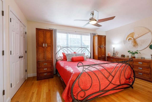 41 Whispering Pine Cir Unit 41, Worcester, MA 01606 - bedroom with light wood-style flooring, a closet, baseboards, and a ceiling fan