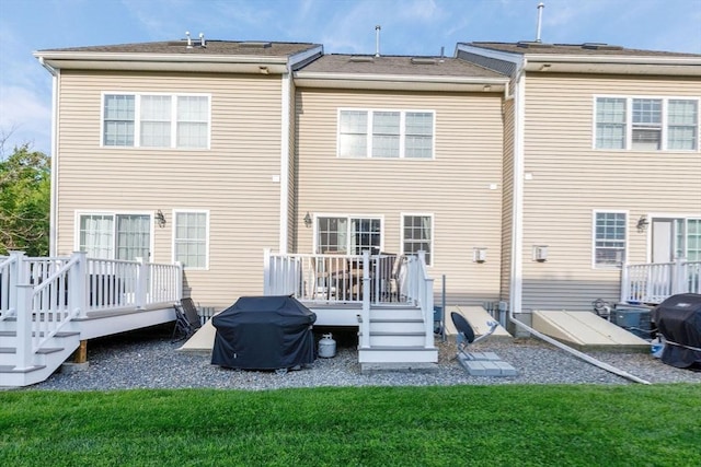 41 Whispering Pine Cir Unit 41, Worcester, MA 01606 - back of property featuring a deck and a lawn
