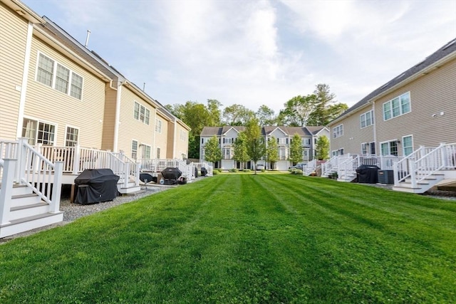 41 Whispering Pine Cir Unit 41, Worcester, MA 01606 - view of grassy yard with a residential view, a wooden deck, and stairway