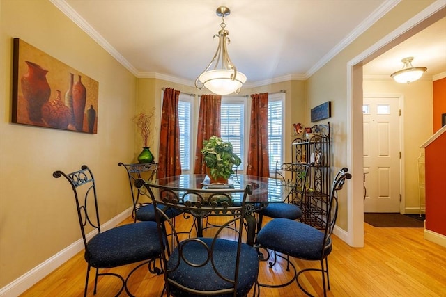 41 Whispering Pine Cir Unit 41, Worcester, MA 01606 - dining area featuring light wood-style floors, crown molding, and baseboards