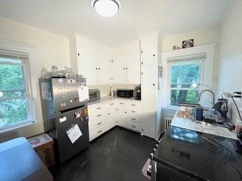 192 Salem St, Wakefield, MA 01880 - kitchen with freestanding refrigerator, plenty of natural light, white cabinets, and range with electric cooktop