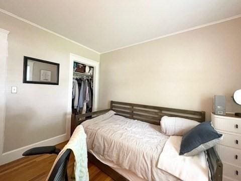 192 Salem St, Wakefield, MA 01880 - bedroom with wood finished floors, crown molding, and a closet