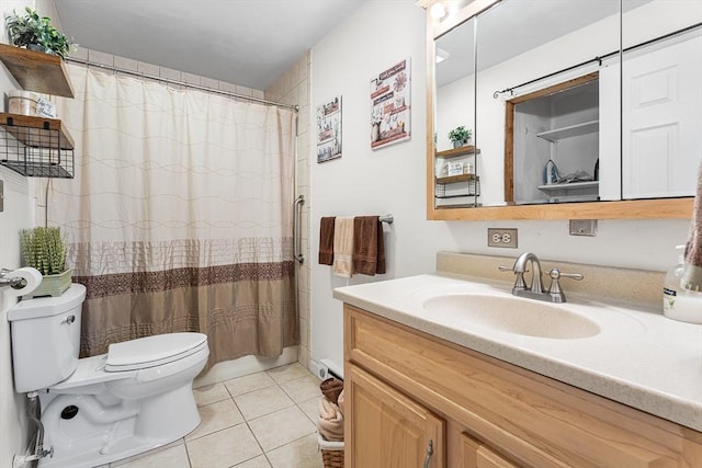 full bathroom featuring a shower with shower curtain, toilet, vanity, and tile patterned flooring