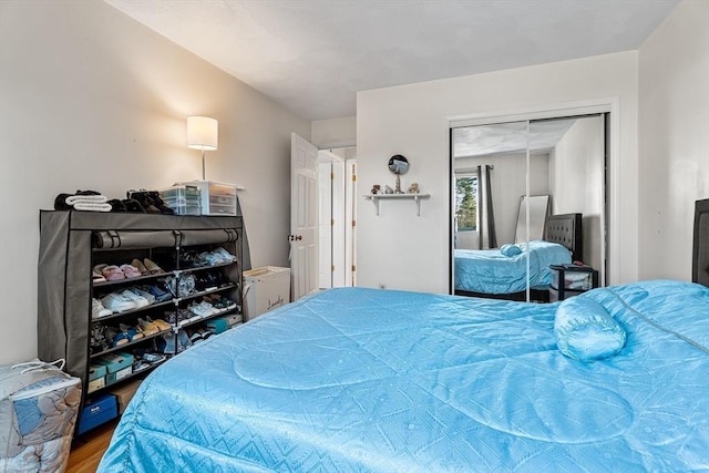 bedroom featuring a closet and wood finished floors