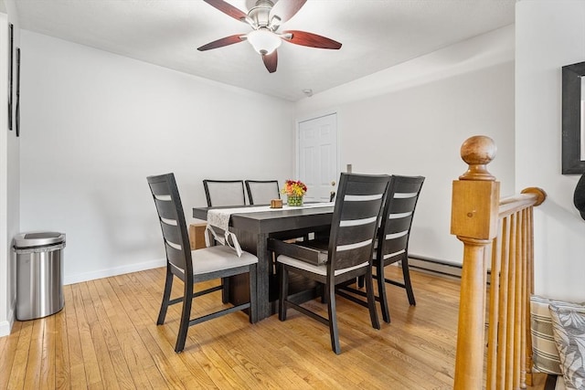 dining area featuring ceiling fan, baseboards, and light wood-style floors