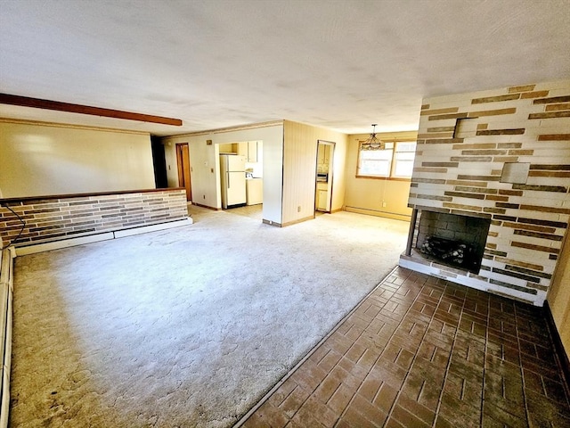 unfurnished living room with a brick fireplace