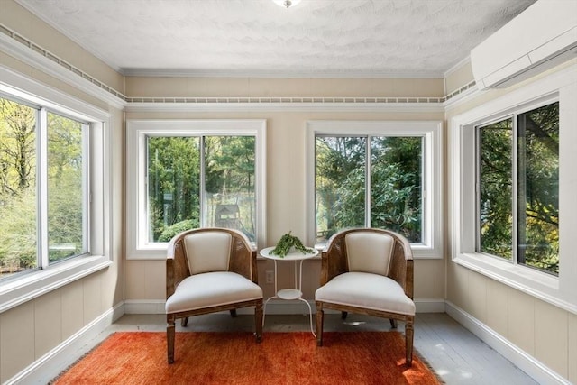 sunroom / solarium featuring a wall unit AC, healthy amount of natural light, a textured ceiling, and ornamental molding