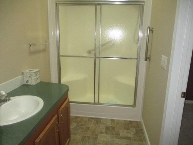 bathroom with vanity and an enclosed shower