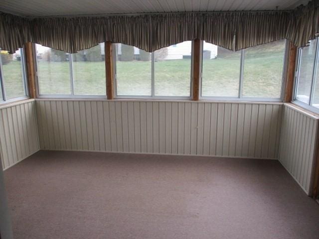 unfurnished sunroom featuring a healthy amount of sunlight