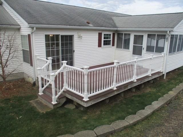 deck featuring a lawn