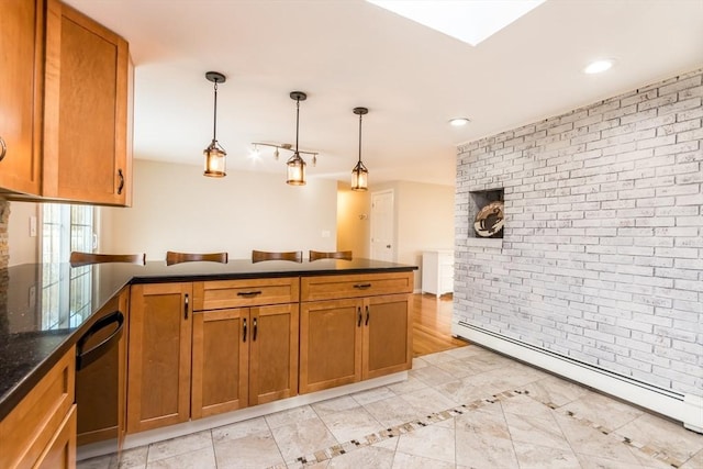 kitchen with kitchen peninsula, dishwasher, pendant lighting, and a baseboard radiator