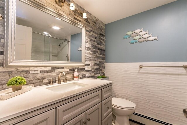 bathroom featuring vanity, a baseboard radiator, an enclosed shower, and toilet