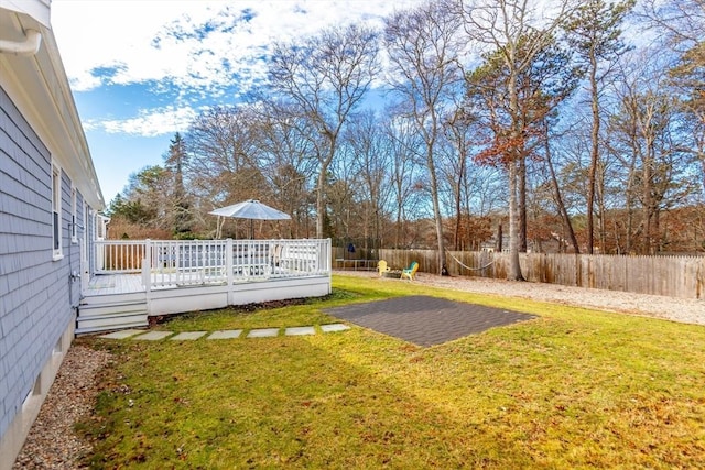 view of yard with a wooden deck