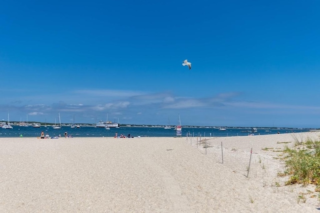 property view of water featuring a beach view