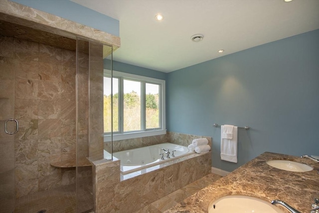 bathroom with a stall shower, visible vents, a sink, and a whirlpool tub