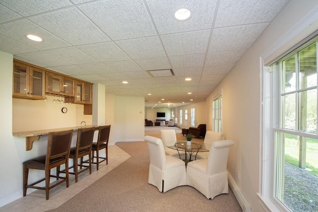 dining room featuring plenty of natural light, baseboards, and recessed lighting