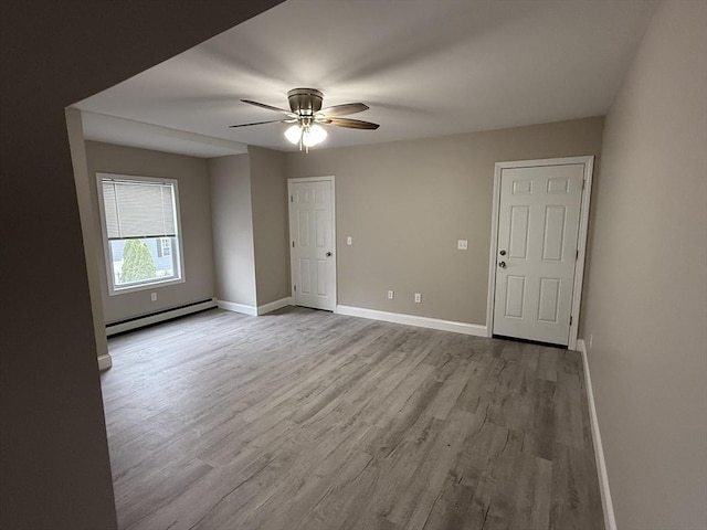 78 Thomas, Fall River, MA 02723 - unfurnished room featuring baseboard heating, a ceiling fan, wood finished floors, and baseboards