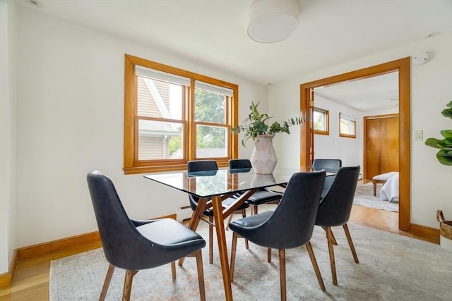51 Burget Ave, Medford, MA 02155 - dining area featuring light wood finished floors and baseboards