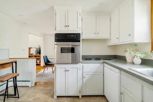 51 Burget Ave, Medford, MA 02155 - kitchen featuring oven, dishwasher, white cabinetry, and electric cooktop
