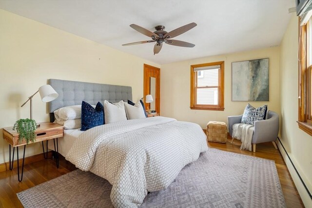 51 Burget Ave, Medford, MA 02155 - bedroom featuring a baseboard radiator, wood finished floors, ceiling fan, and baseboards
