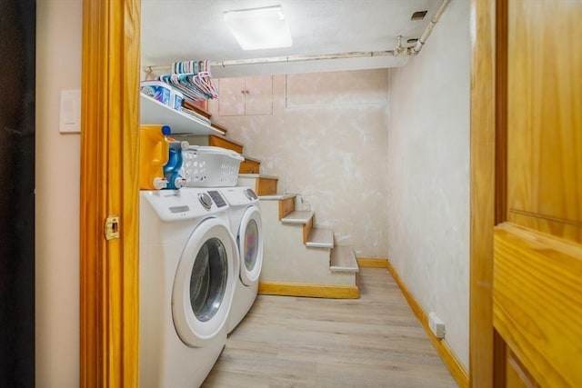 51 Burget Ave, Medford, MA 02155 - laundry room with washing machine and clothes dryer, light wood-style floors, and baseboards