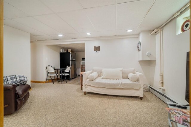 51 Burget Ave, Medford, MA 02155 - living room featuring a baseboard radiator, recessed lighting, carpet, and a paneled ceiling