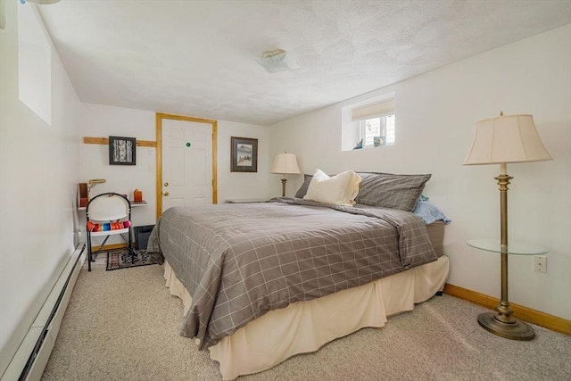 51 Burget Ave, Medford, MA 02155 - carpeted bedroom with a baseboard heating unit and baseboards