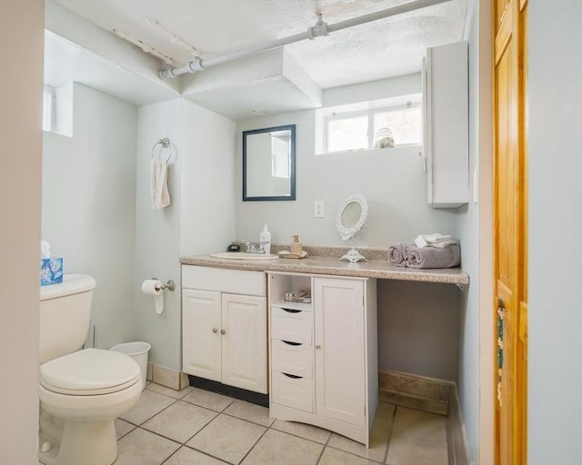 51 Burget Ave, Medford, MA 02155 - bathroom with vanity, toilet, and tile patterned flooring