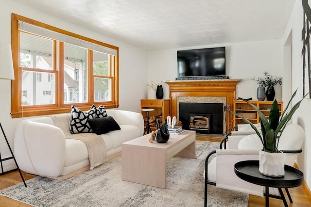 51 Burget Ave, Medford, MA 02155 - living area with wood finished floors and a tiled fireplace