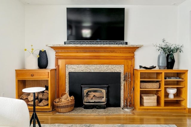 51 Burget Ave, Medford, MA 02155 - detailed view of wood finished floors and a fireplace with flush hearth