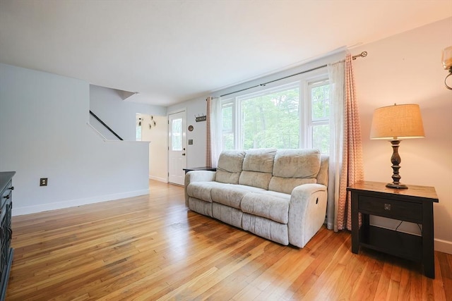 57 Hawes St, Wrentham, MA 02093 - living area featuring light wood-type flooring and stairs