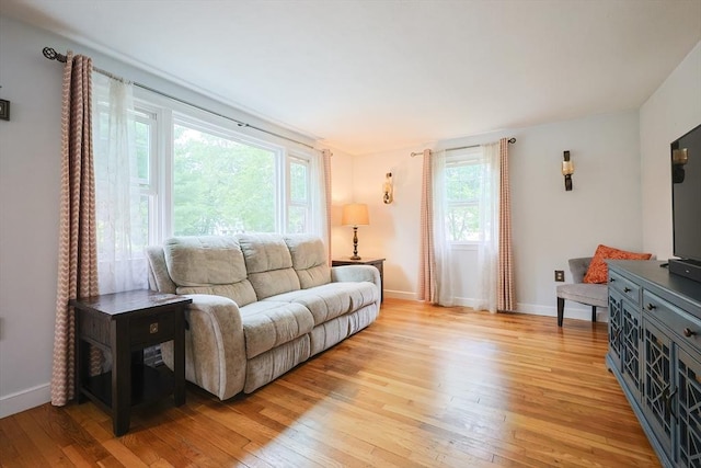 57 Hawes St, Wrentham, MA 02093 - living room featuring light wood finished floors and healthy amount of natural light