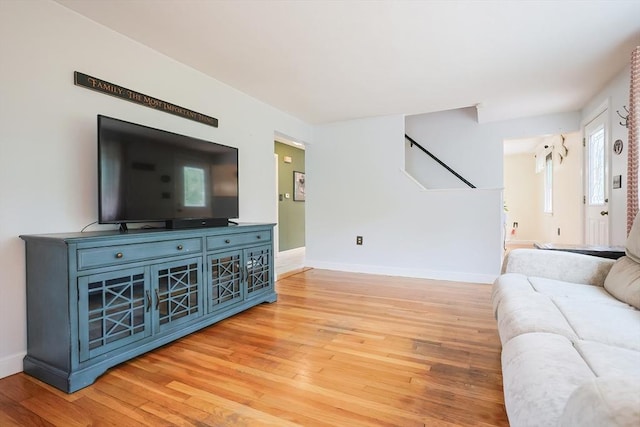 57 Hawes St, Wrentham, MA 02093 - living area featuring light wood-style floors and stairs