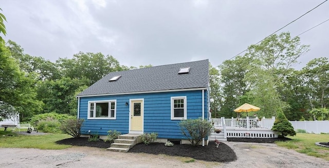 57 Hawes St, Wrentham, MA 02093 - view of front of house with a deck, roof with shingles, and view of scattered trees