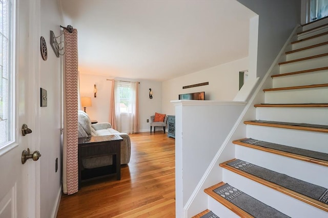 57 Hawes St, Wrentham, MA 02093 - stairway featuring wood finished floors and baseboards