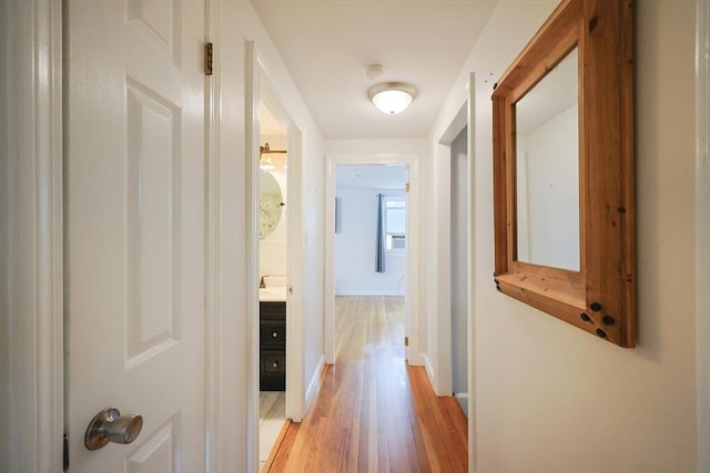 57 Hawes St, Wrentham, MA 02093 - hall with light wood-style flooring and baseboards