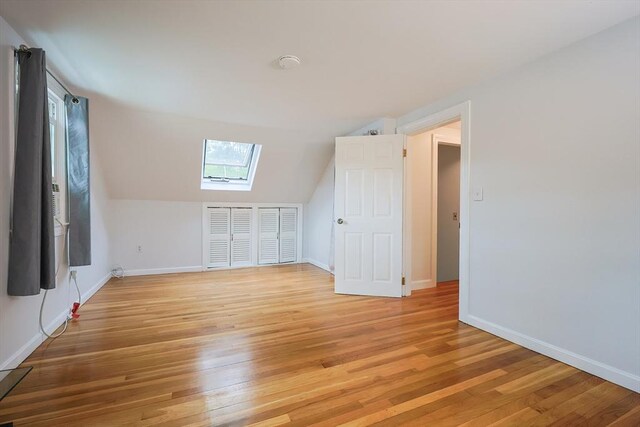57 Hawes St, Wrentham, MA 02093 - bonus room with a skylight, light wood finished floors, and vaulted ceiling
