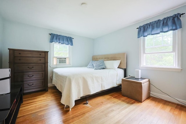 57 Hawes St, Wrentham, MA 02093 - bedroom with light wood-style flooring and cooling unit