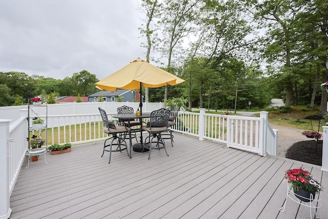 57 Hawes St, Wrentham, MA 02093 - wooden terrace featuring a lawn, outdoor dining area, and view of scattered trees