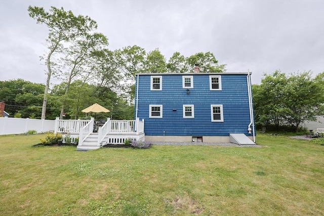 57 Hawes St, Wrentham, MA 02093 - rear view of house with a wooden deck and a chimney