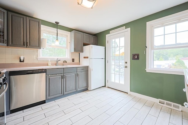 57 Hawes St, Wrentham, MA 02093 - kitchen featuring appliances with stainless steel finishes, light countertops, and plenty of natural light
