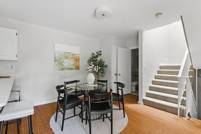 87 E Bluff Rd Unit 87, Ashland, MA 01721 - dining space with light wood-style floors, stairs, and baseboards