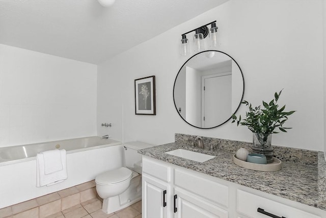 87 E Bluff Rd Unit 87, Ashland, MA 01721 - bathroom featuring vanity, a bath, toilet, and tile patterned flooring