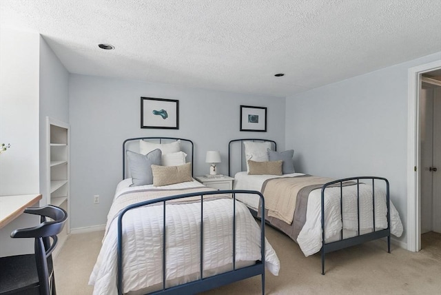87 E Bluff Rd Unit 87, Ashland, MA 01721 - bedroom featuring light carpet, a textured ceiling, and baseboards